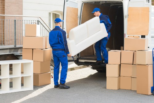 Removal team loading household items in Abbeywood