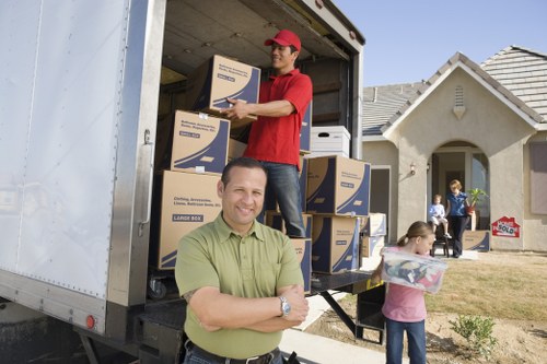 Local moving team handling boxes and household items in Abbeywood