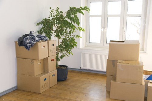 Packed boxes and furniture prepared for transport by a local removals company