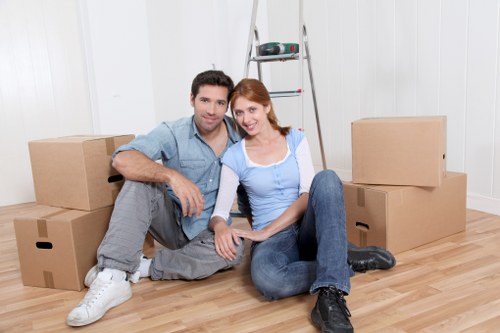 Professional movers handling office furniture in Abbeywood