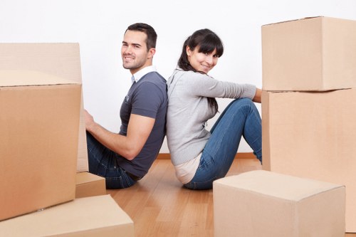 Loading furniture into a van for a home move in Abbeywood