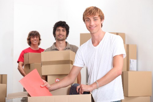 Packed moving boxes and furniture ready for transport