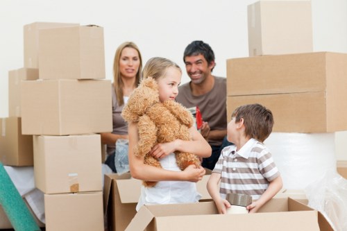 Commercial relocation team moving desks and office items locally